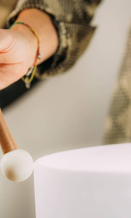 Crystal singing bowls in a sound healing therapy session